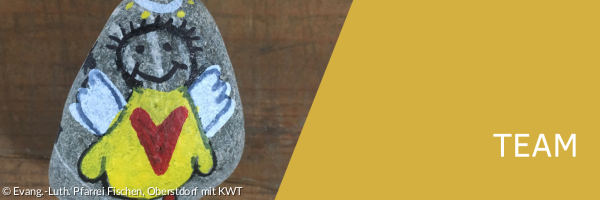 Stein mit kleinem Engel darauf.